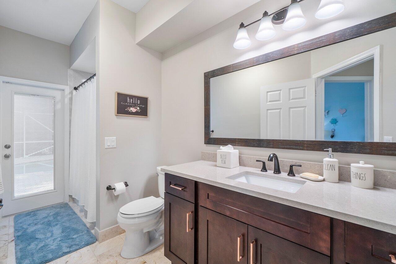 21432 Crestfalls Court Boca Raton, FL 33428 - Photo 19 of 31 a bathroom with a sink vanity granite and toilet