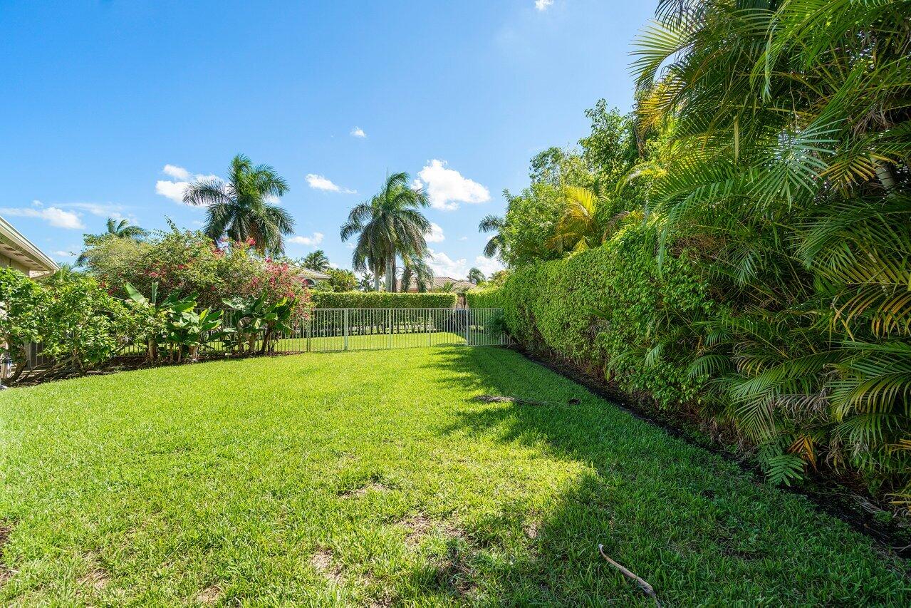 21432 Crestfalls Court Boca Raton, FL 33428 - Photo 24 of 31 a view of an outdoor space and a yard