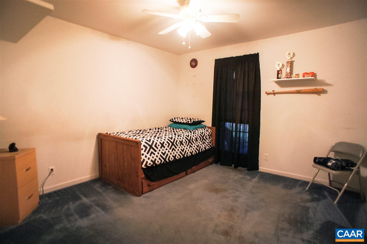 532 Watson Road Ruckersville, VA 22968 - Photo 11 of 21 a bed room with a bed and a ceiling fan