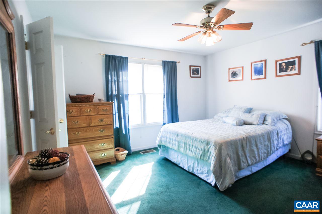 532 Watson Road Ruckersville, VA 22968 - Photo 14 of 21 a bedroom with a bed and a window