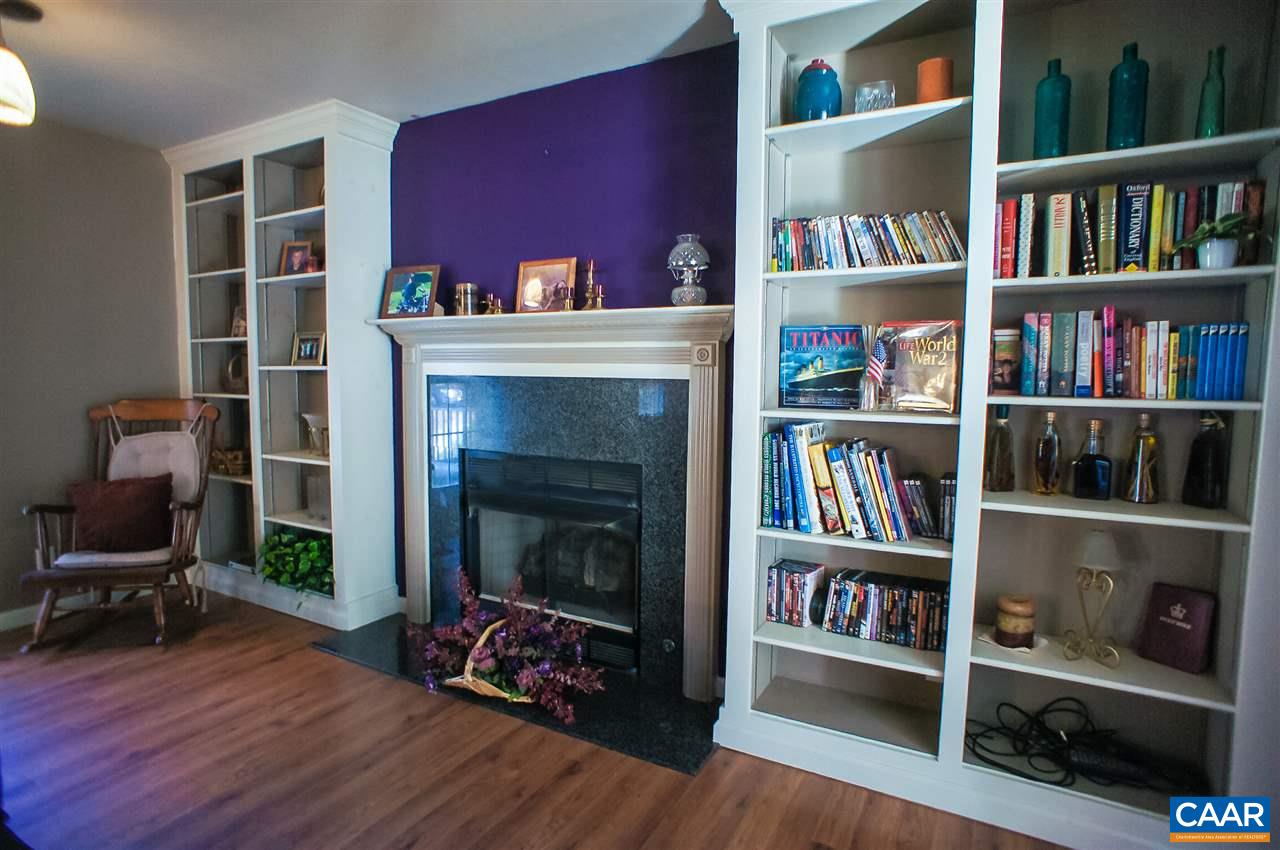 532 Watson Road Ruckersville, VA 22968 - Photo 5 of 21 a living room with furniture and a book shelf