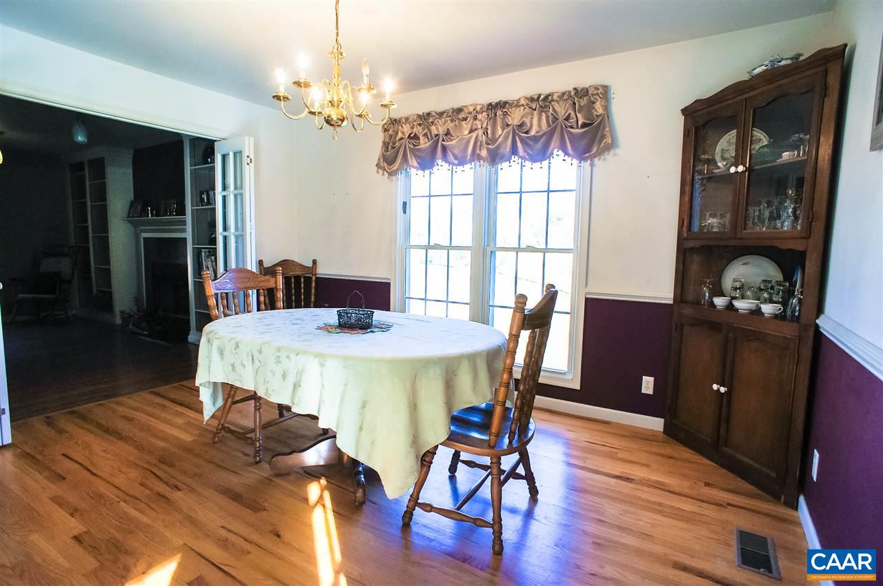 532 Watson Road Ruckersville, VA 22968 - Photo 6 of 21 a view of a dining room with furniture a chandelier and wooden floor