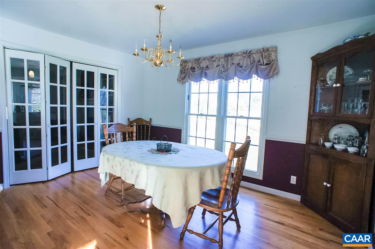 532 Watson Road Ruckersville, VA 22968 - Photo 7 of 21 a view of a dining room with furniture window and wooden floor