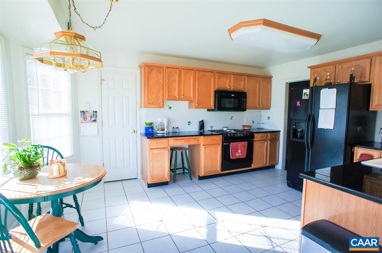 532 Watson Road Ruckersville, VA 22968 - Photo 8 of 21 a kitchen with stainless steel appliances granite countertop a sink and a refrigerator