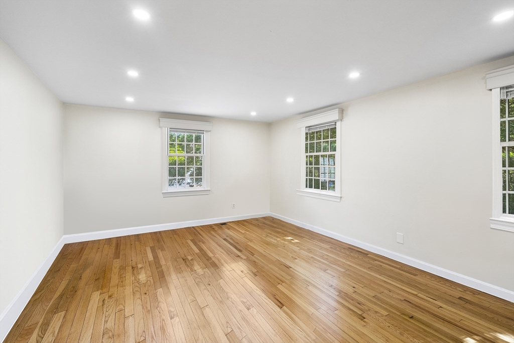 24 Jericho Road, Unit 24 Weston, MA 02493 - Photo 21 of 36 a view of empty room with wooden floor and fan