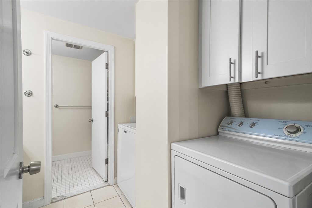 24 Jericho Road, Unit 24 Weston, MA 02493 - Photo 26 of 36 a view of storage and utility room with washer and dryer