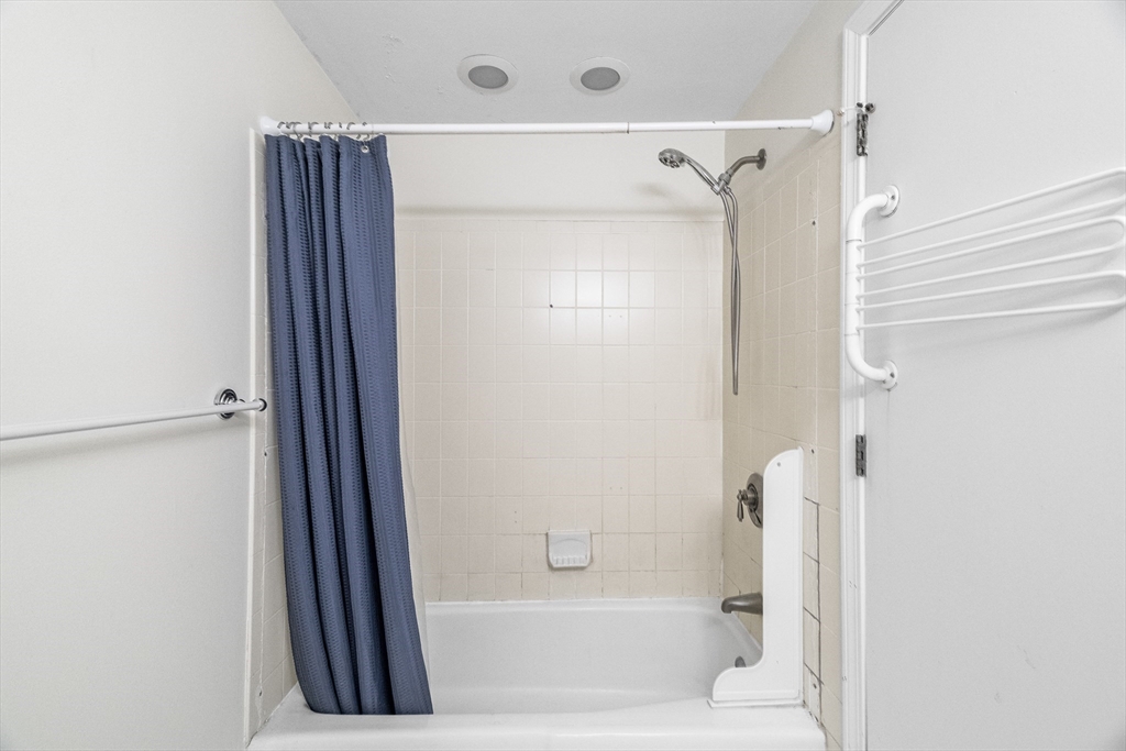 24 Jericho Road, Unit 24 Weston, MA 02493 - Photo 29 of 36 a bathroom with a bathtub and a shower