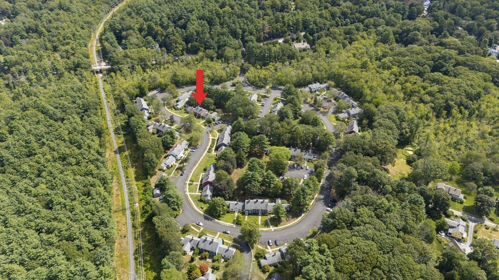 24 Jericho Road, Unit 24 Weston, MA 02493 - Photo 3 of 36 a view of a house with a flower garden