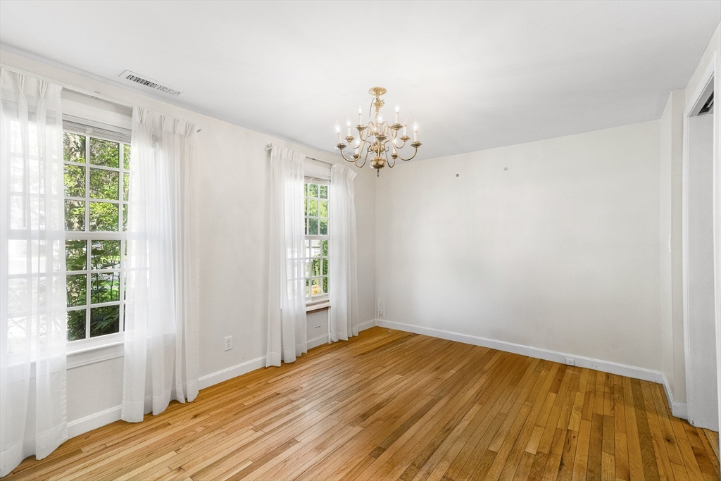 24 Jericho Road, Unit 24 Weston, MA 02493 - Photo 7 of 36 a view of a room with wooden floor and natural light
