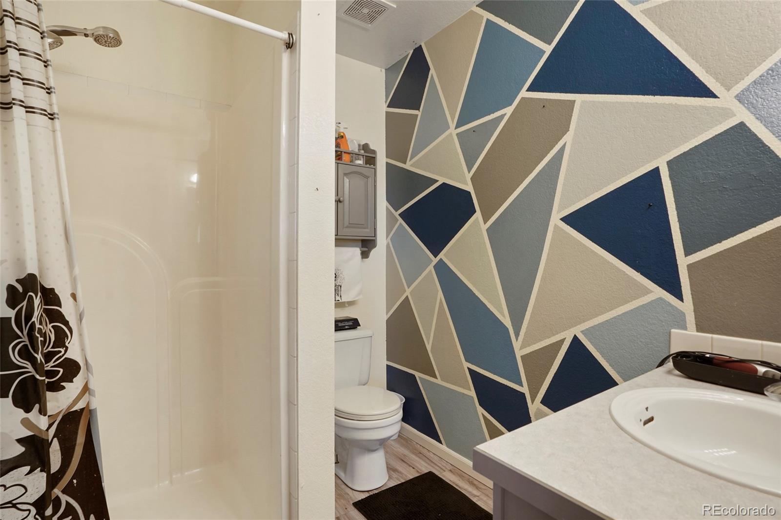 1200 7th Street Fort Lupton, CO 80621 - Photo 11 of 17 a bathroom with a sink and a toilet