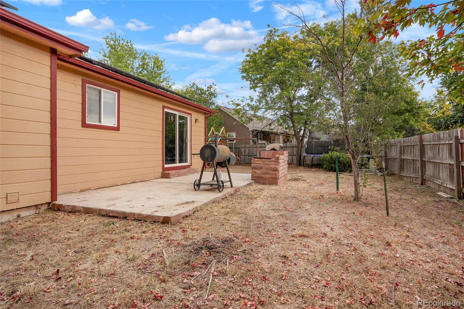 1200 7th Street Fort Lupton, CO 80621 - Photo 14 of 17 a backyard of a house with table and chairs