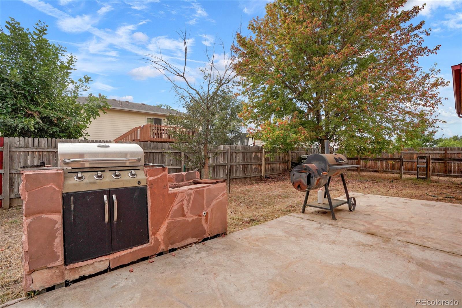 1200 7th Street Fort Lupton, CO 80621 - Photo 15 of 17 a view of a yard with a slide