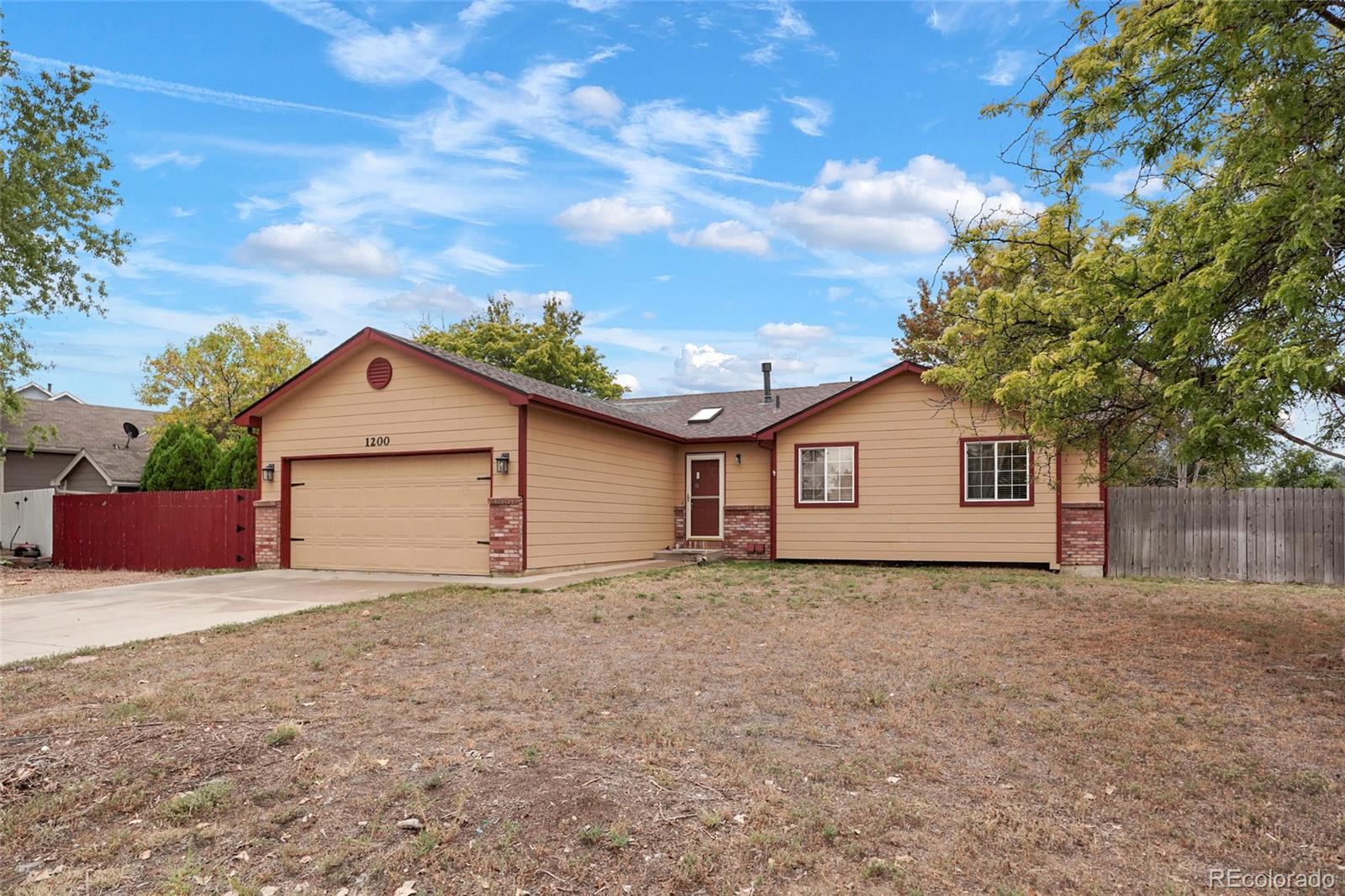 1200 7th Street Fort Lupton, CO 80621 - Photo 17 of 17 a view of a house with a yard and large tree