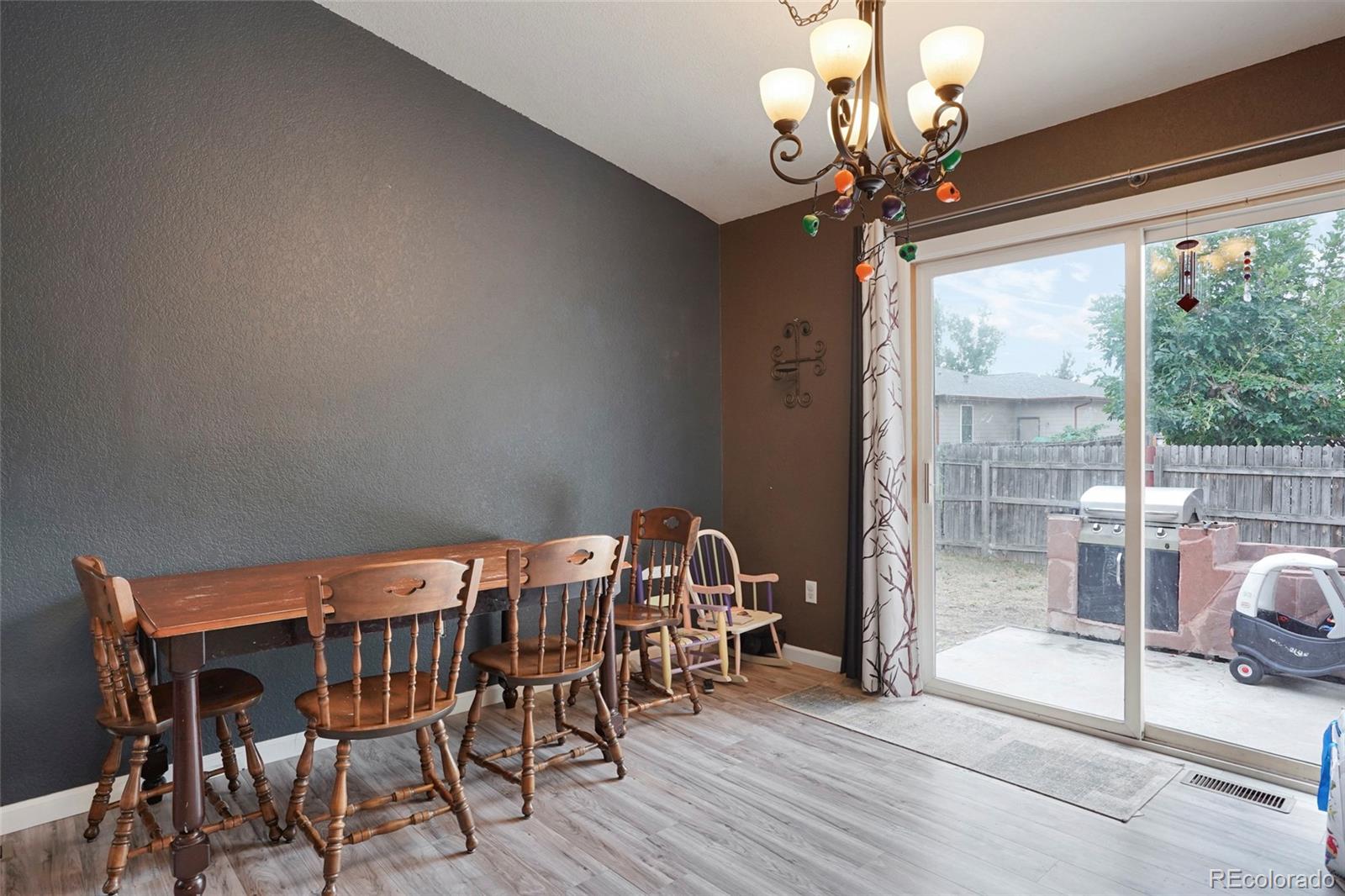 1200 7th Street Fort Lupton, CO 80621 - Photo 7 of 17 a view of a dining room with furniture window and outside view