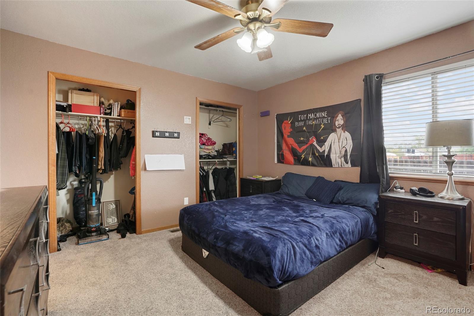 1200 7th Street Fort Lupton, CO 80621 - Photo 8 of 17 a bedroom with a bed and a dresser