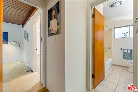 a bathroom with a tub and a shower
