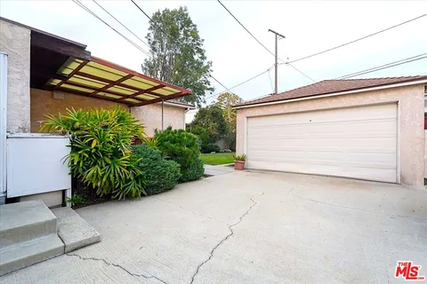 a view of a house with a street