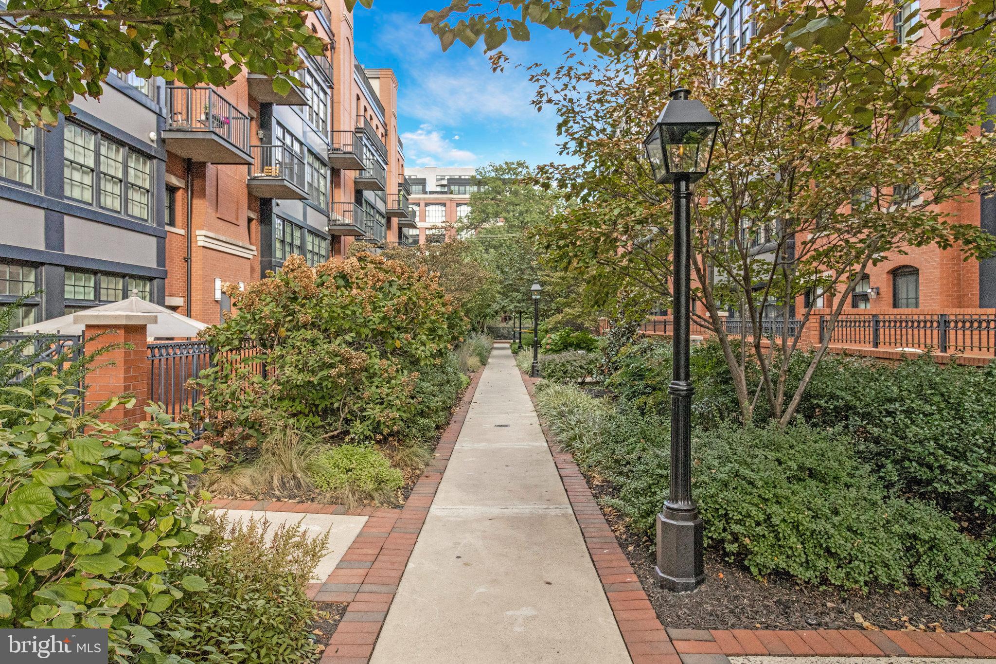 1610 North Queen Street, Unit 211 Arlington, VA 22209 - Photo 1 of 43 a view of a pathway both side of house