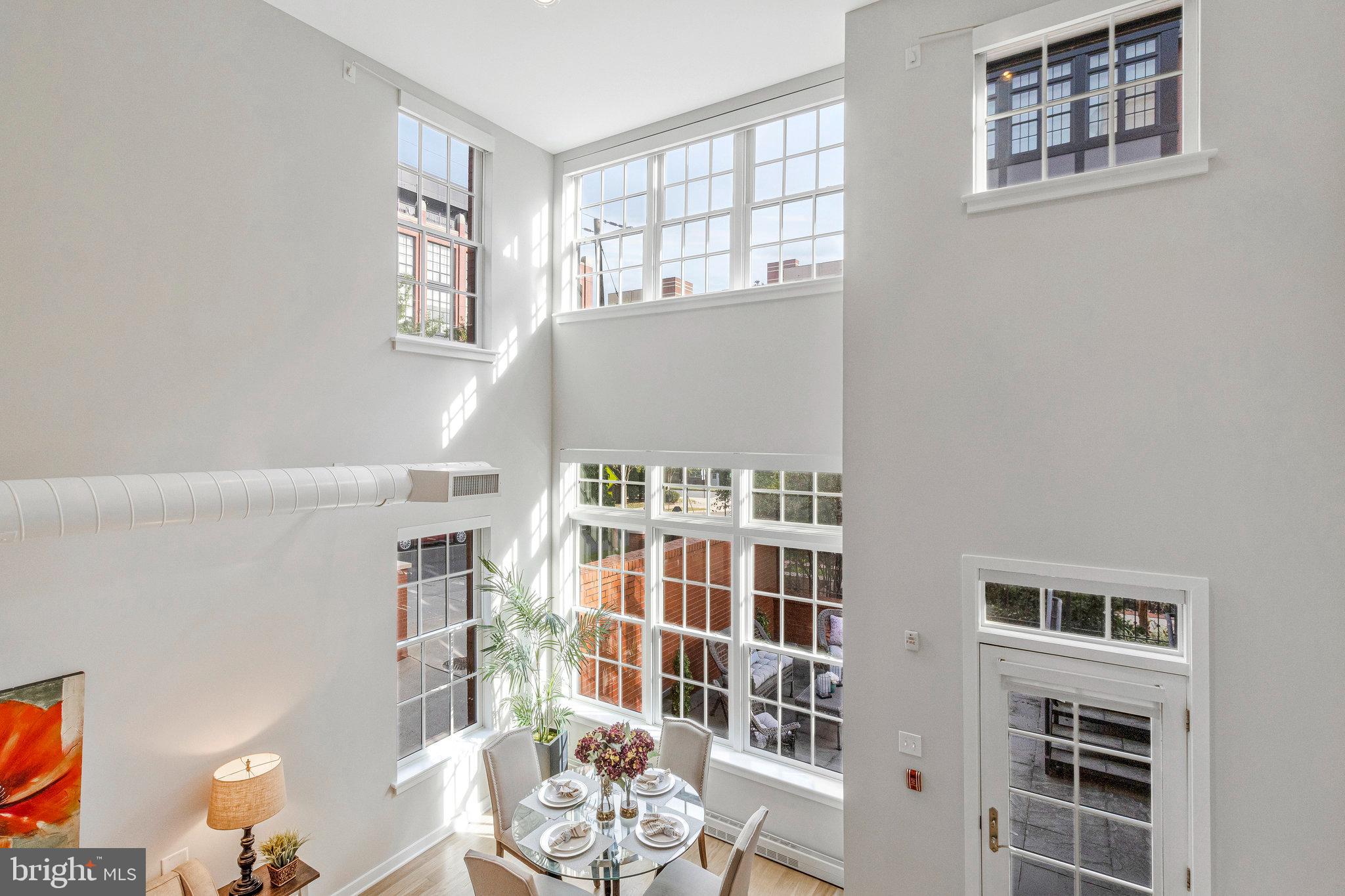 1610 North Queen Street, Unit 211 Arlington, VA 22209 - Photo 14 of 43 a view of a living room with windows