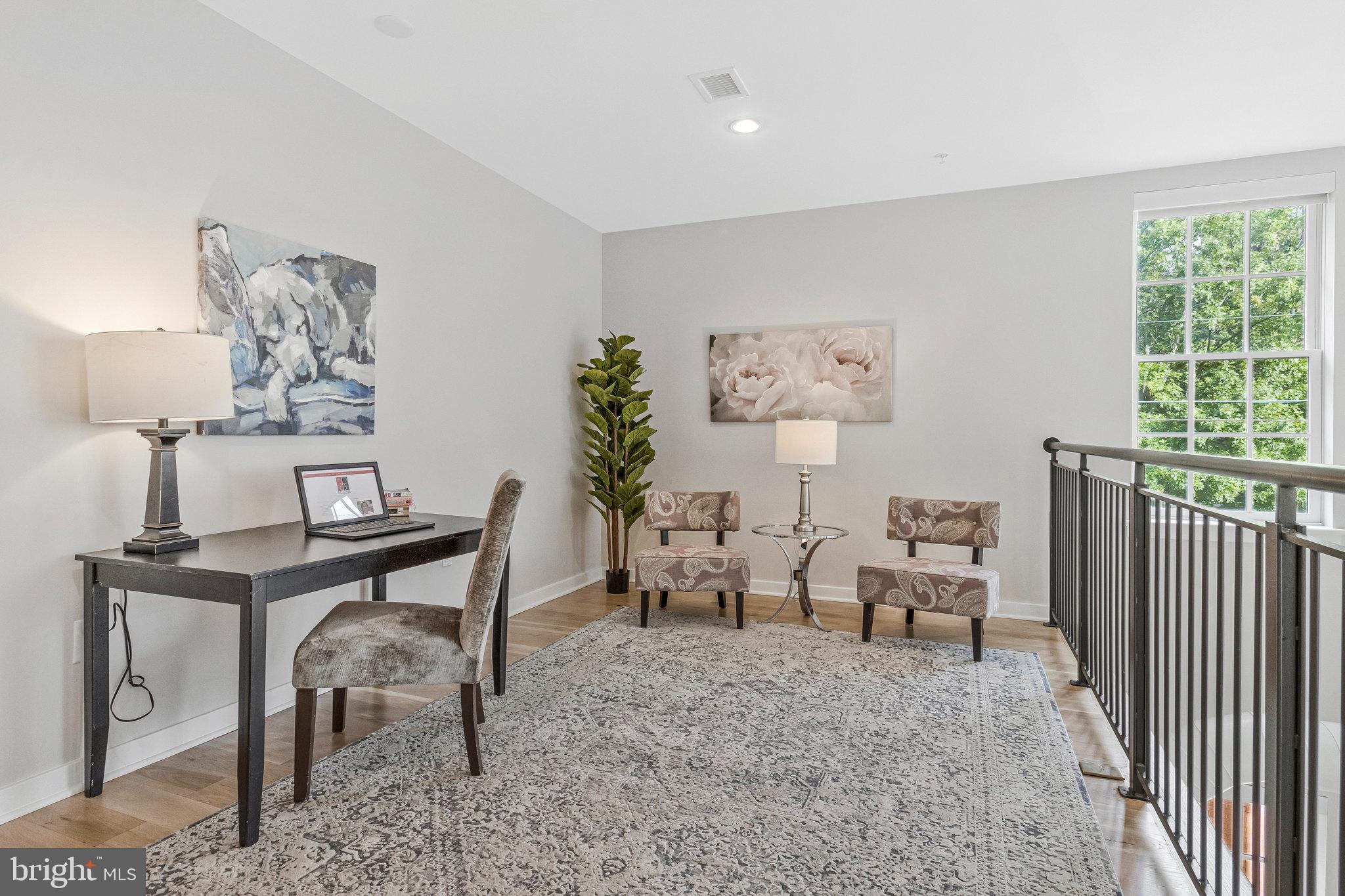 1610 North Queen Street, Unit 211 Arlington, VA 22209 - Photo 17 of 43 a view of a workspace with furniture and a window