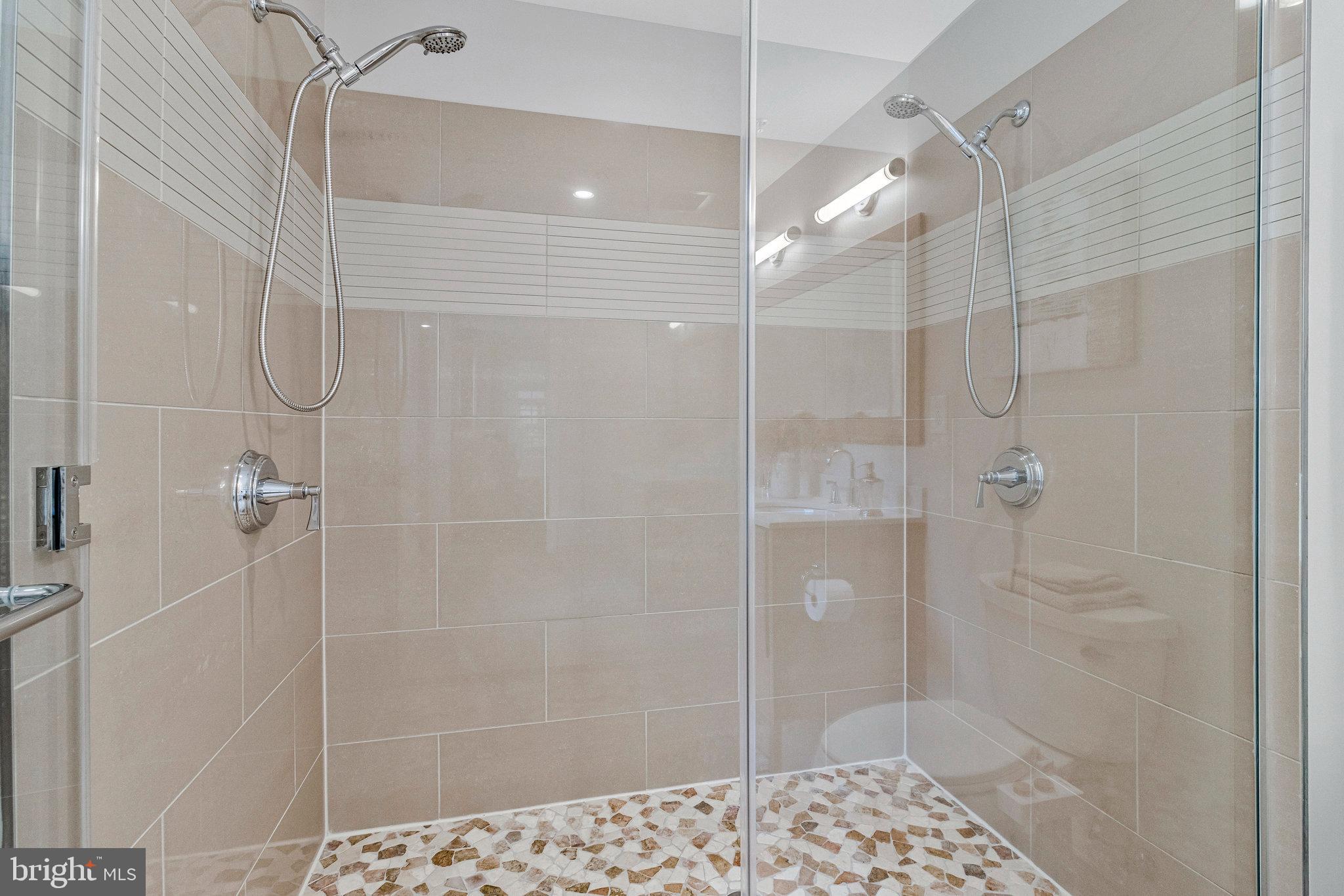 1610 North Queen Street, Unit 211 Arlington, VA 22209 - Photo 23 of 43 a bathroom with a shower
