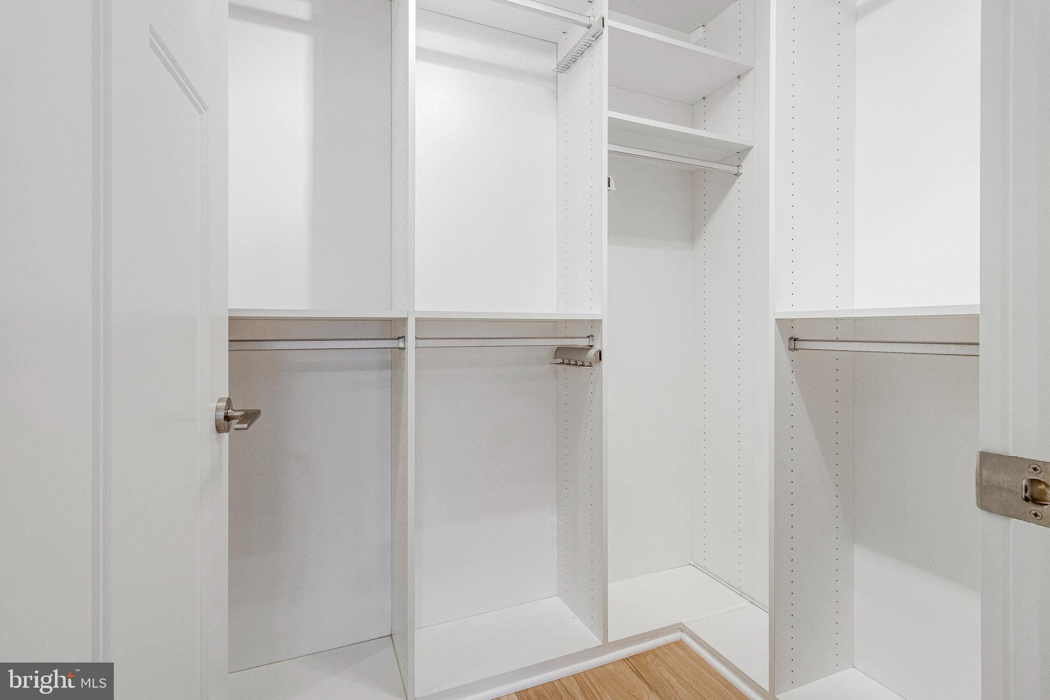 1610 North Queen Street, Unit 211 Arlington, VA 22209 - Photo 24 of 43 a bathroom with a glass shower door