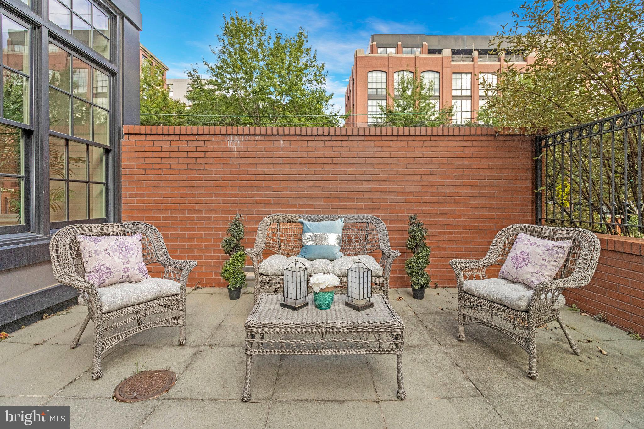 1610 North Queen Street, Unit 211 Arlington, VA 22209 - Photo 37 of 43 a view of a chairs and table in the balcony