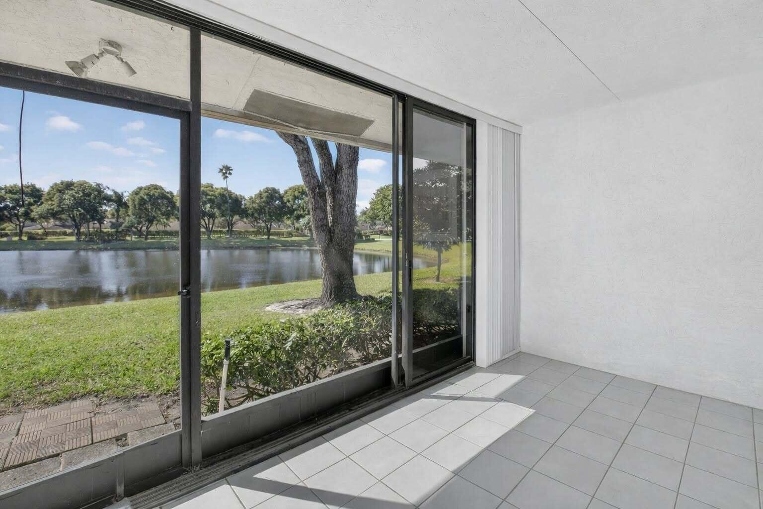 8146 Windgate Drive Boca Raton, FL 33496 - Photo 11 of 24 a view of a room with window and an outdoor space