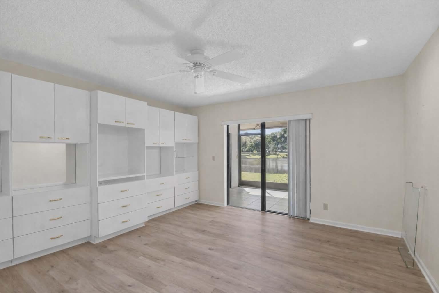 8146 Windgate Drive Boca Raton, FL 33496 - Photo 8 of 24 wooden floor in an empty room