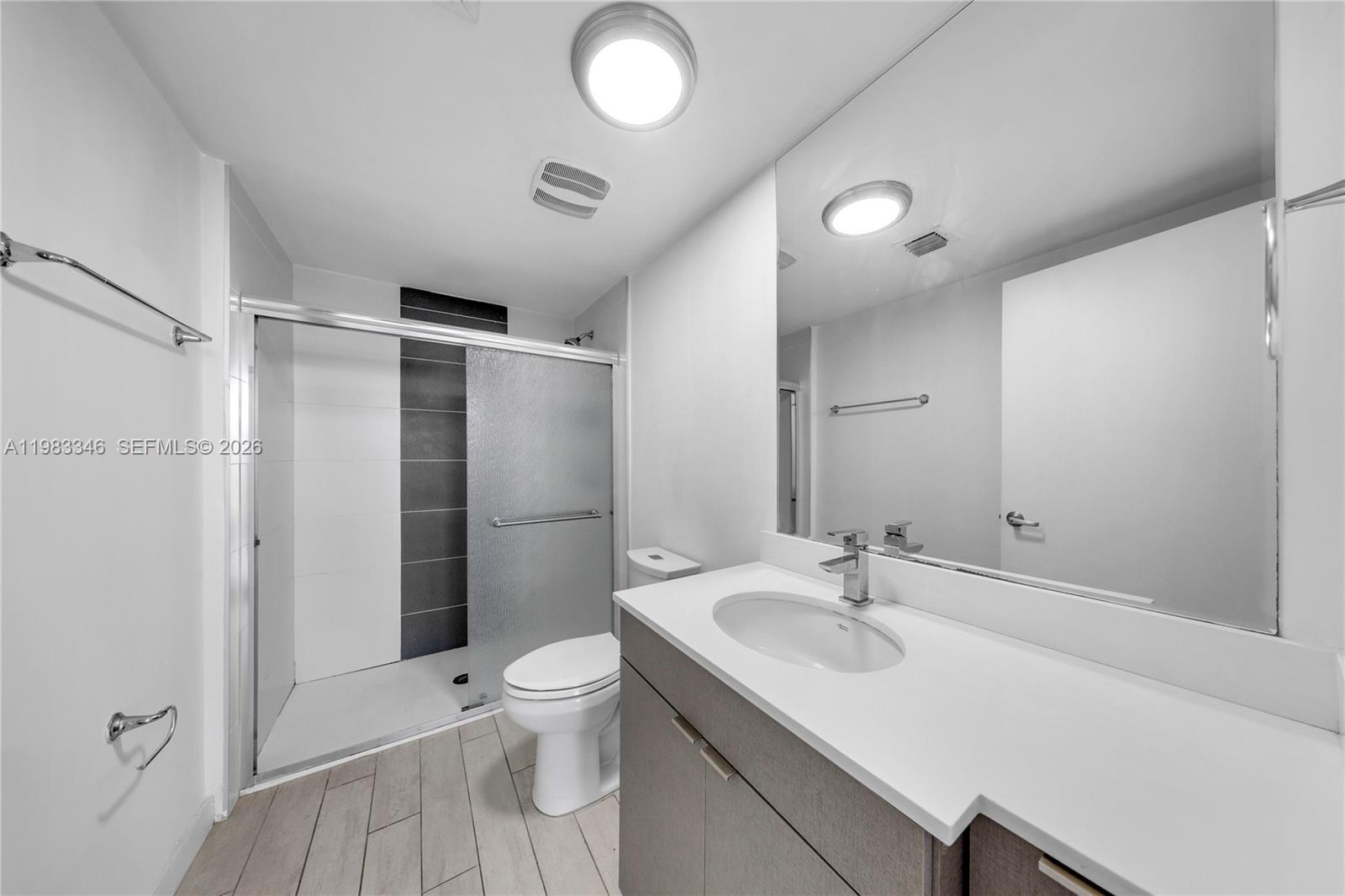 321 Northeast 26th Street, Unit 701 Miami, FL 33137 - Photo 11 of 24 a bathroom with a sink toilet and shower