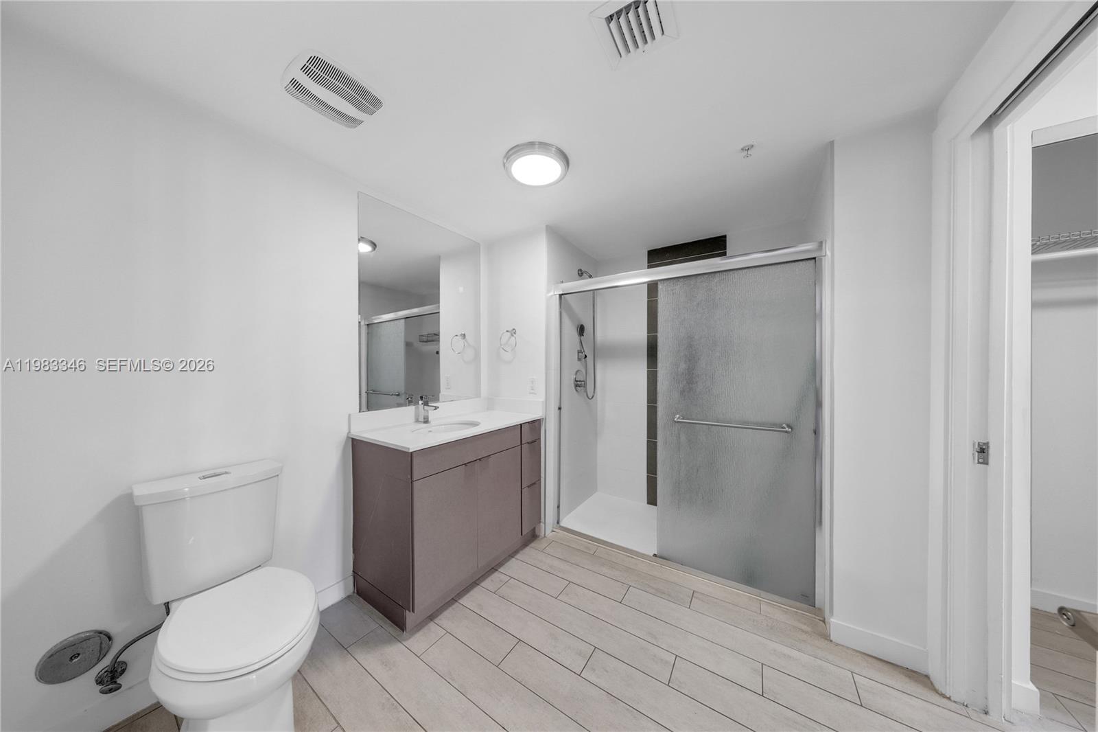 321 Northeast 26th Street, Unit 701 Miami, FL 33137 - Photo 15 of 24 a bathroom with a toilet sink and shower