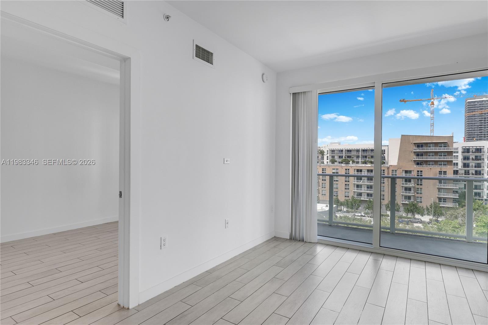 321 Northeast 26th Street, Unit 701 Miami, FL 33137 - Photo 18 of 24 a view of livingroom with furniture and wooden floor