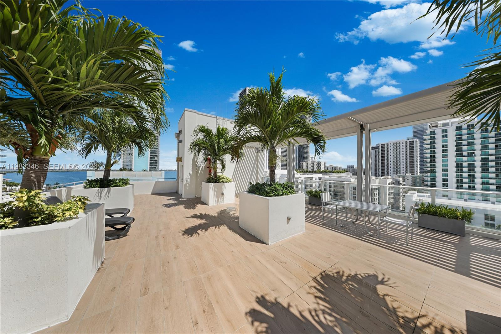 321 Northeast 26th Street, Unit 701 Miami, FL 33137 - Photo 4 of 24 a view of a house with backyard and sitting area