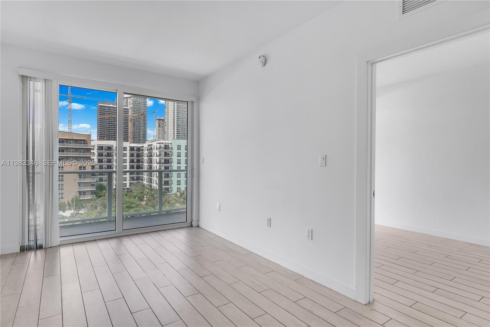 321 Northeast 26th Street, Unit 701 Miami, FL 33137 - Photo 5 of 24 a view of entryway with wooden floor