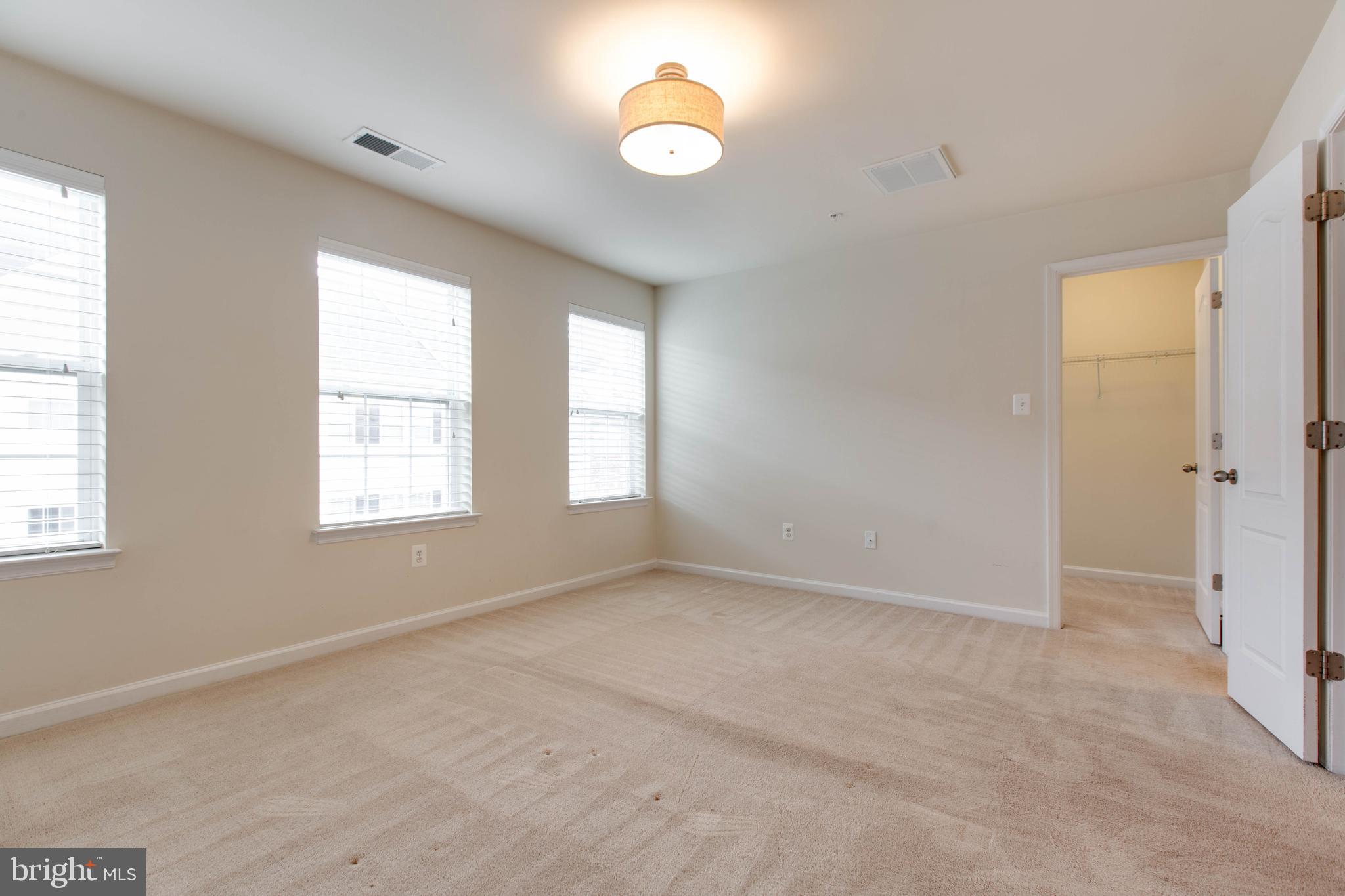 7048 Foxton Way Hanover, MD 21076 - Photo 27 of 52 a view of an empty room with a window