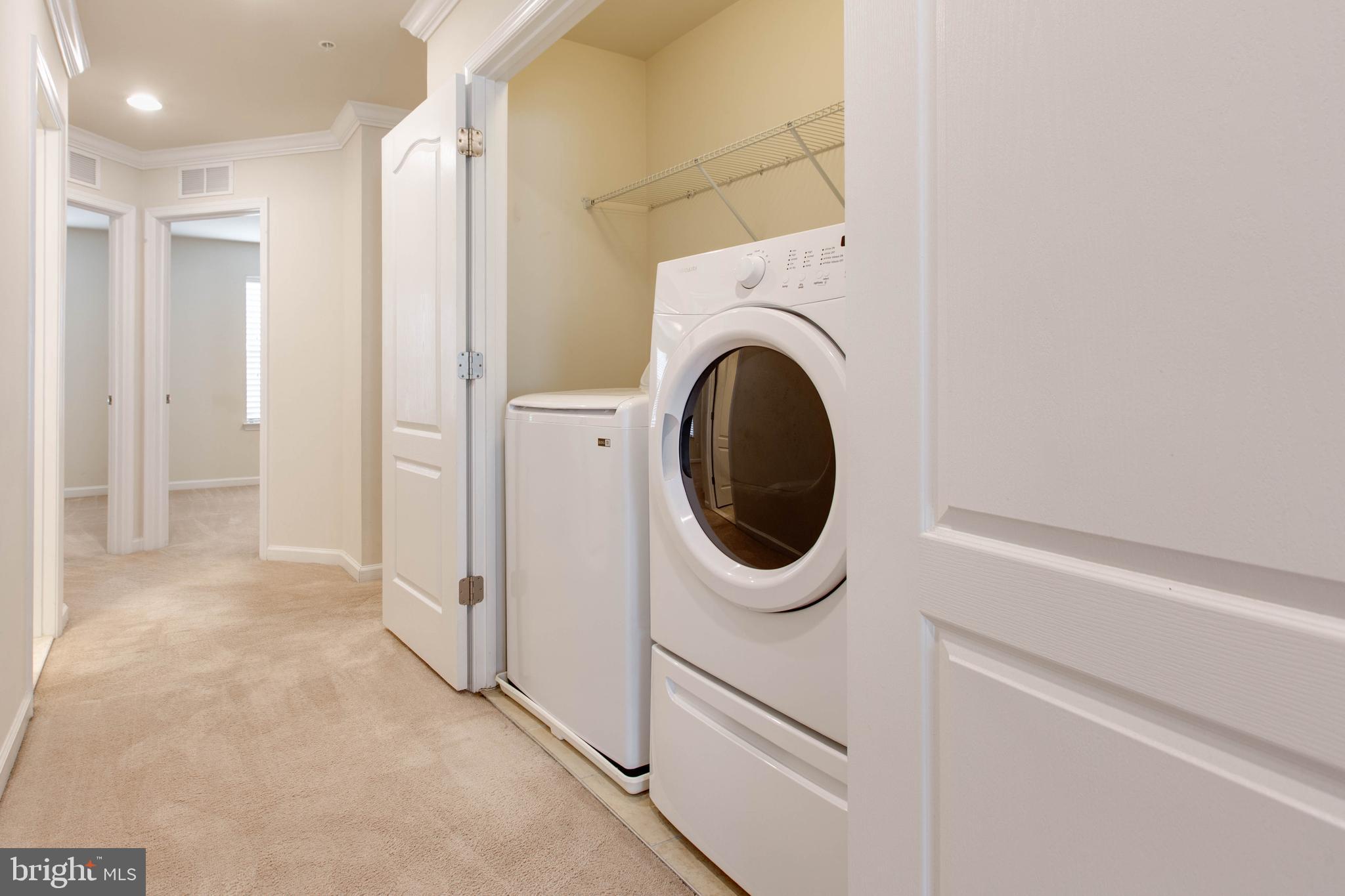 7048 Foxton Way Hanover, MD 21076 - Photo 40 of 52 a view of a hallway with washer and dryer