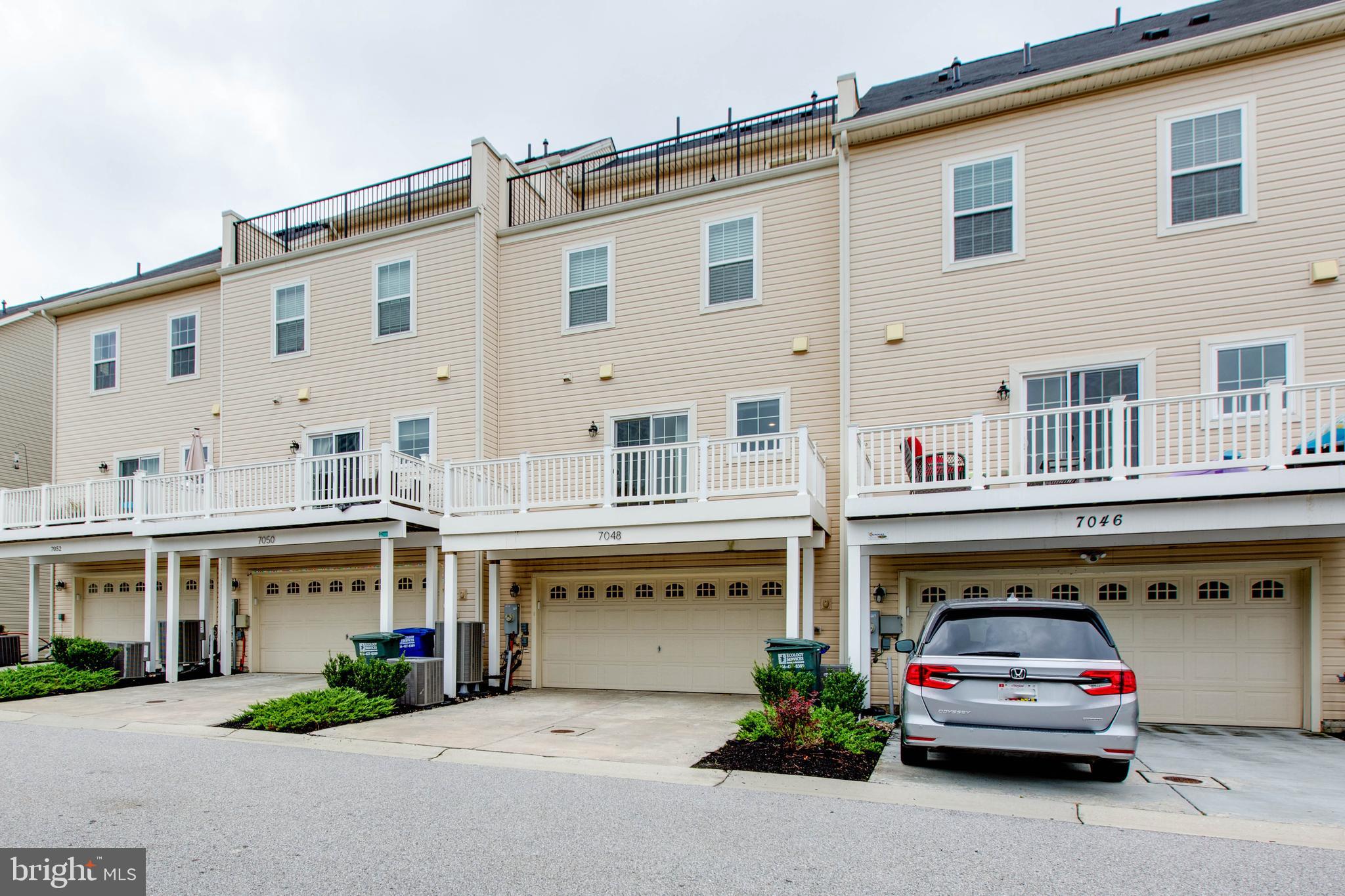 7048 Foxton Way Hanover, MD 21076 - Photo 51 of 52 a car parked in front of a building