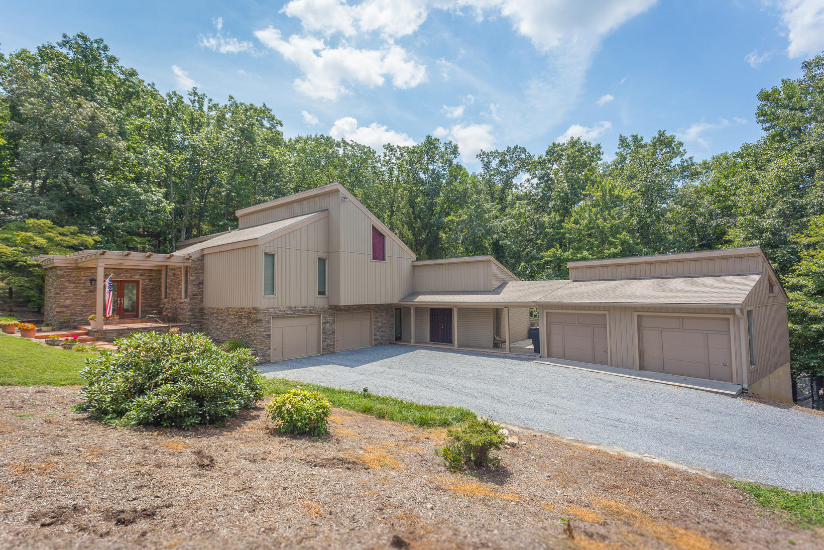 5244 Falcon Ridge Road Roanoke, VA 24018 - Photo 1 of 49 a front view of a house with a yard and a garage