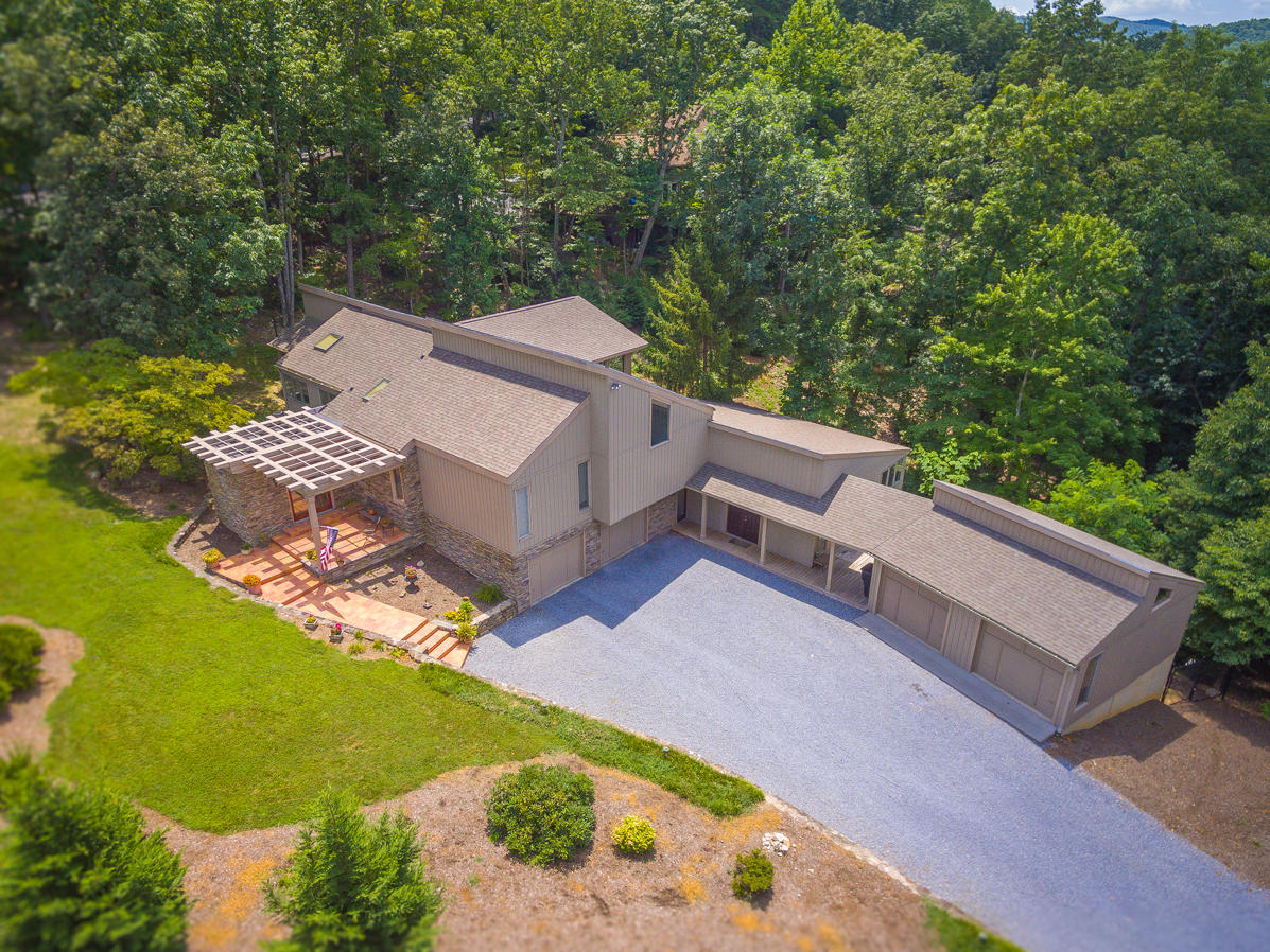 5244 Falcon Ridge Road Roanoke, VA 24018 - Photo 3 of 49 an aerial view of a house with a garden and lake view