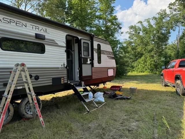 a backyard of a house with barbeque oven