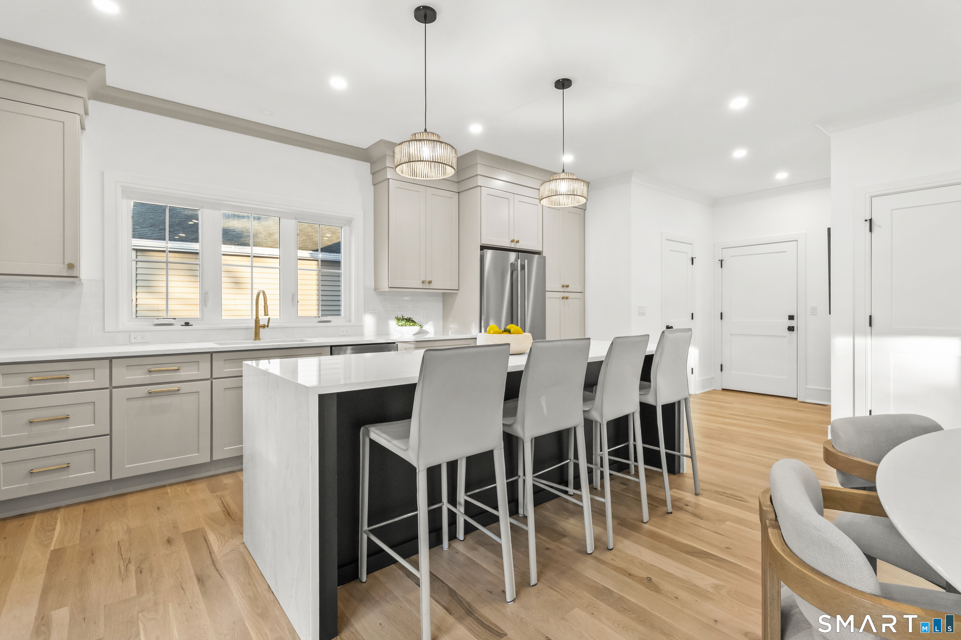 28 Country Road, Unit 28A Fairfield, CT 06824 - Photo 6 of 32 Plenty of seating at the island, everyone is always gathered in the kitchen