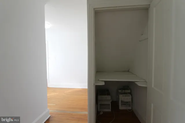a view of utility room and empty room