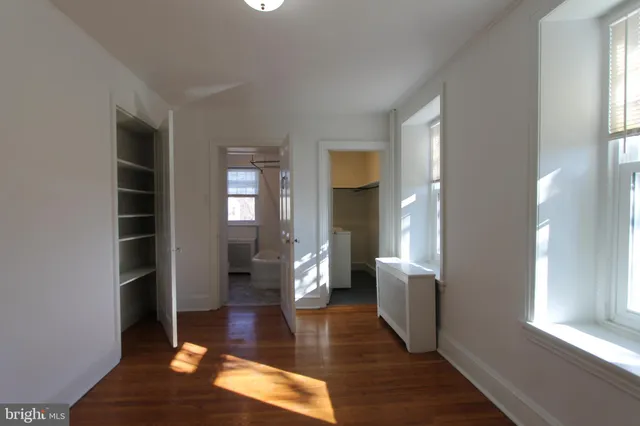 a view of an entryway of the house and wooden floor