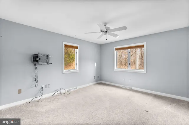 a view of a big room with windows