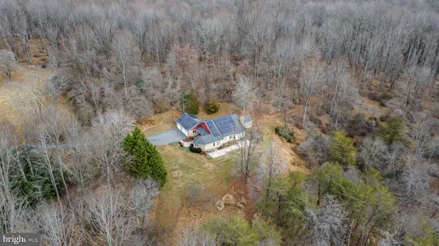 a aerial view of a house with a yard