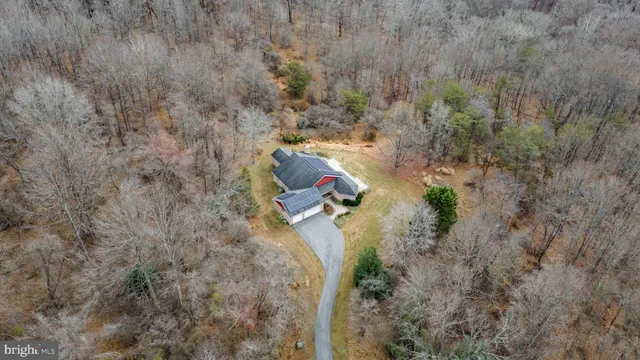 a bird view of house with outdoor space