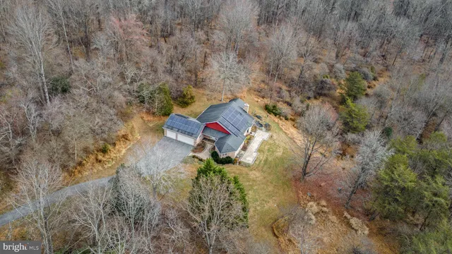 a picture of a room with a floor and a ceiling fan