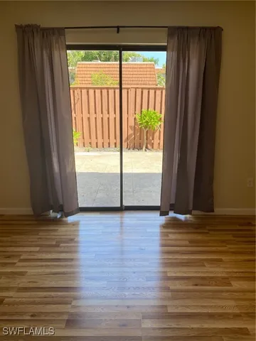 a view of staircase with wooden floor