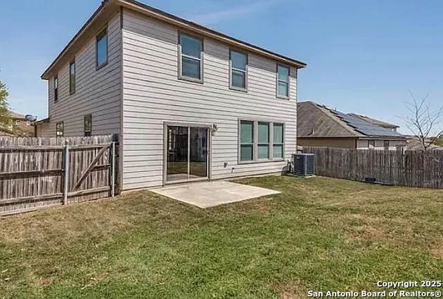 a house with wooden fence