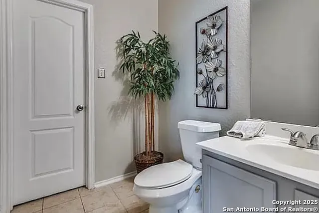a bathroom with a toilet and a sink